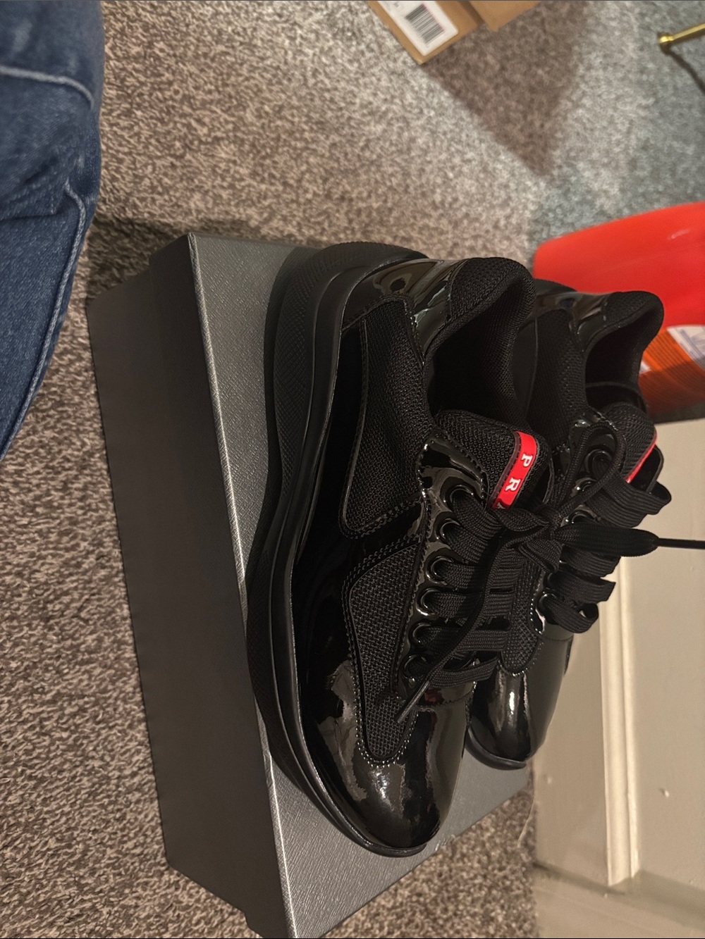 Prada Men's Black Low-Top Sneakers with Red Accent